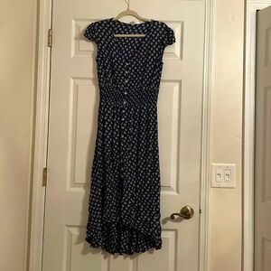 Navy Blue dress with little white designs, and white buttons.